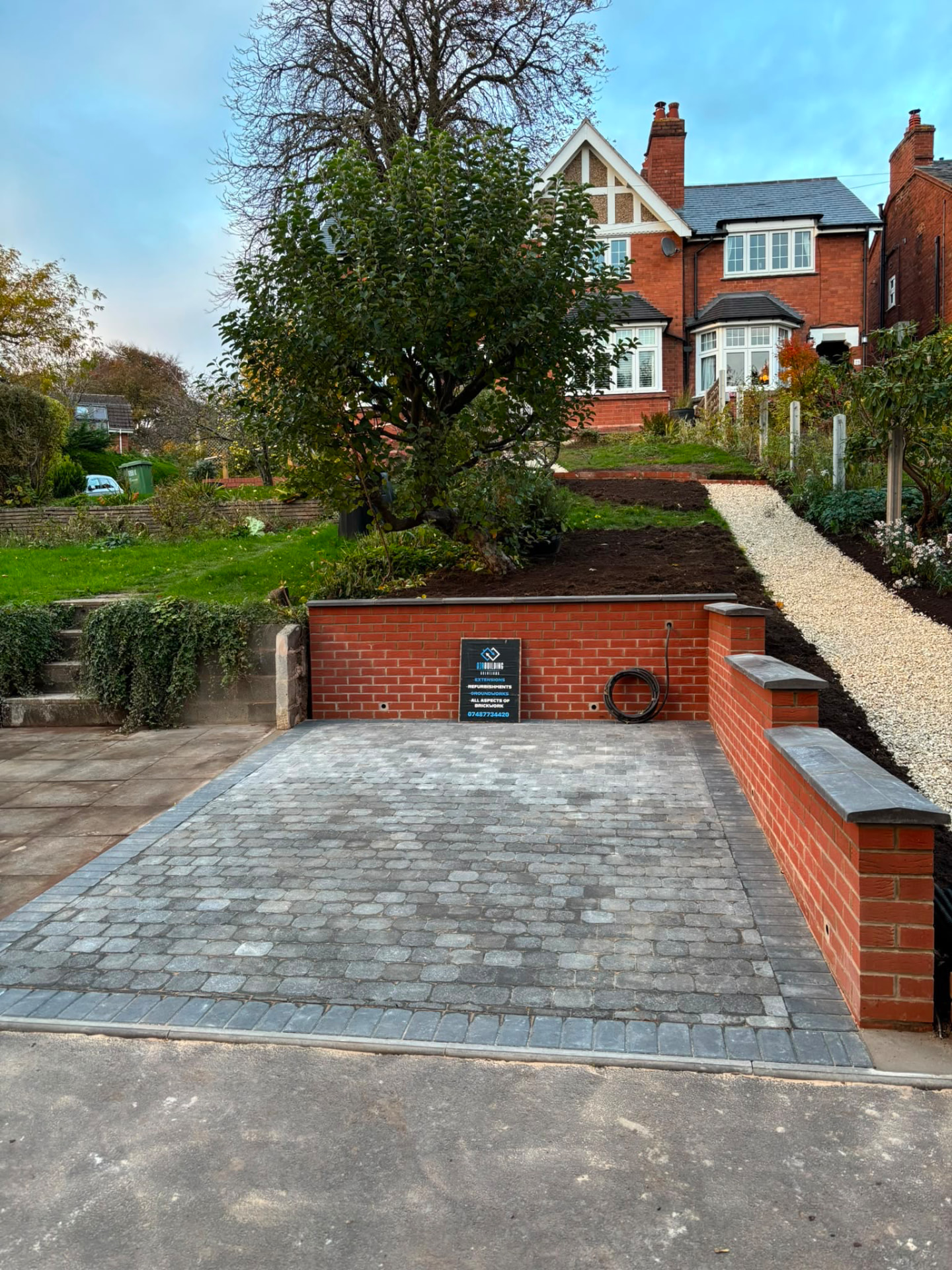 Sloped Garden to Driveway & Retaining Wall after brickwork completed